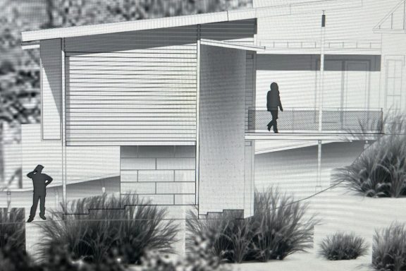 Modern architectural model with figures walking near a sleek building structure.